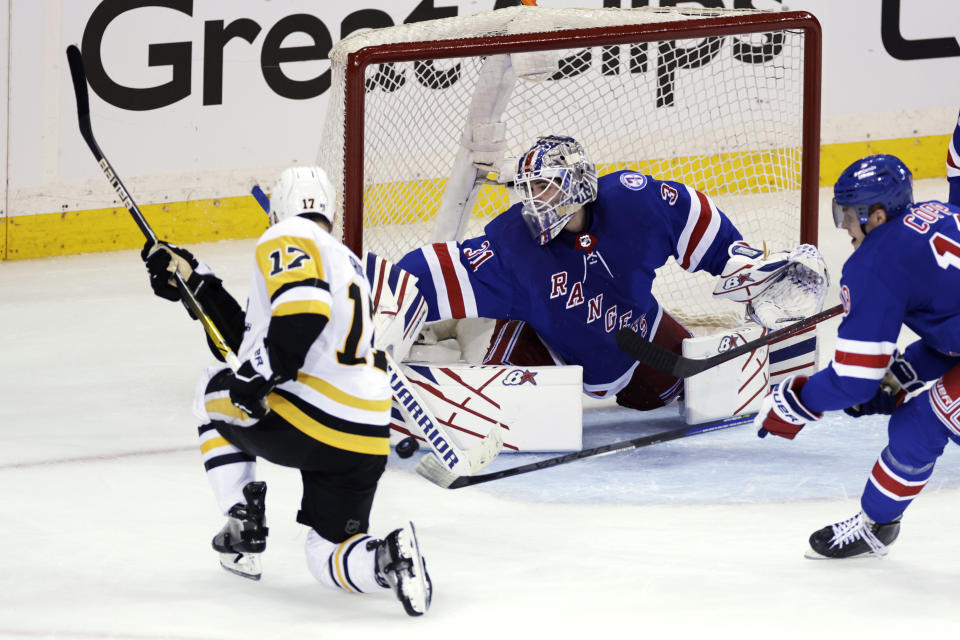 New York Rangers goaltender Igor Shesterkin makes a save on a shot by Pittsburgh Penguins right wing Bryan Rust (17) during the third period of Game 1 of an NHL hockey Stanley Cup first-round playoff series Tuesday, May 3, 2022, in New York. (AP Photo/Adam Hunger)