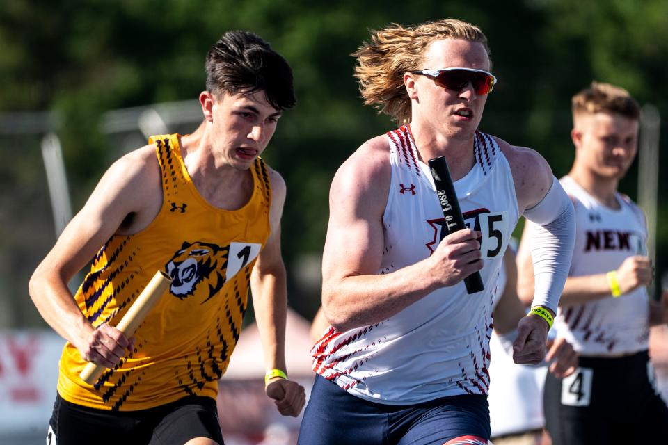 Ballard's Eli Rouse, right, runs the 3A 4x400 meter relay during the Iowa high school state track and field meet at Drake Stadium on Saturday.