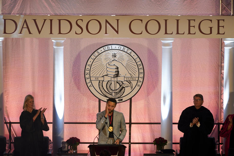 Golden State Warriors Stephen Curry reacts as his number and jersey were retired at Davidson College on Wednesday, Aug. 31, 2022, in Davidson, N.C. Curry was also inducted into the school's Hall of Fame and had his graduation ceremony. (AP Photo/Chris Carlson)