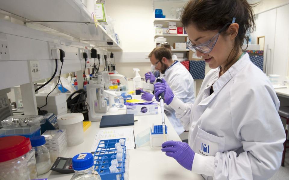 Staff working in Astrazeneca's Medimmune biologic laboratory in Cambridge - Rex Features