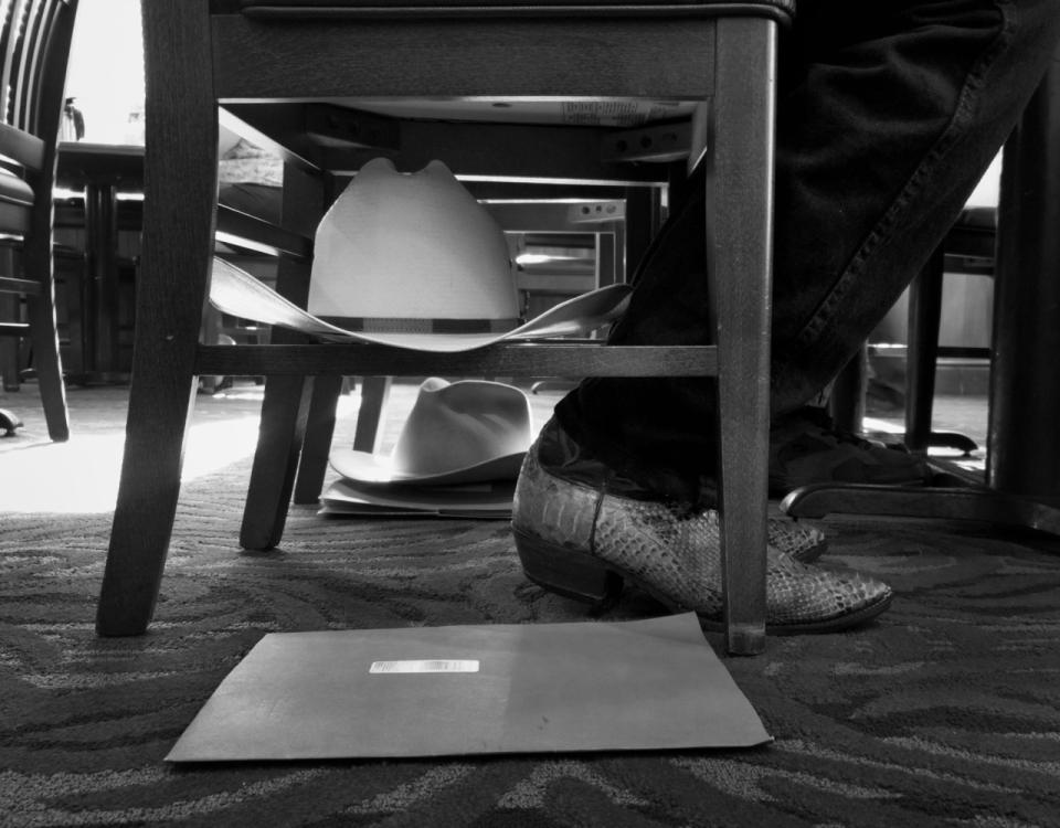 <p>Montana delegates store their cowboy hats underneath their chairs during breakfast at Bob Evans. (Photo: Khue Bui for Yahoo News)</p>