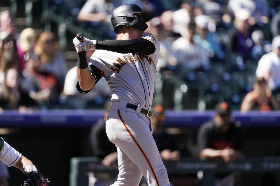 San Francisco Giants' Blake Sabol hits a two-run double during the second inning in the first baseball game of a doubleheader against the Colorado Rockies, Saturday, Sept. 16, 2023. (AP Photo/David Zalubowski)