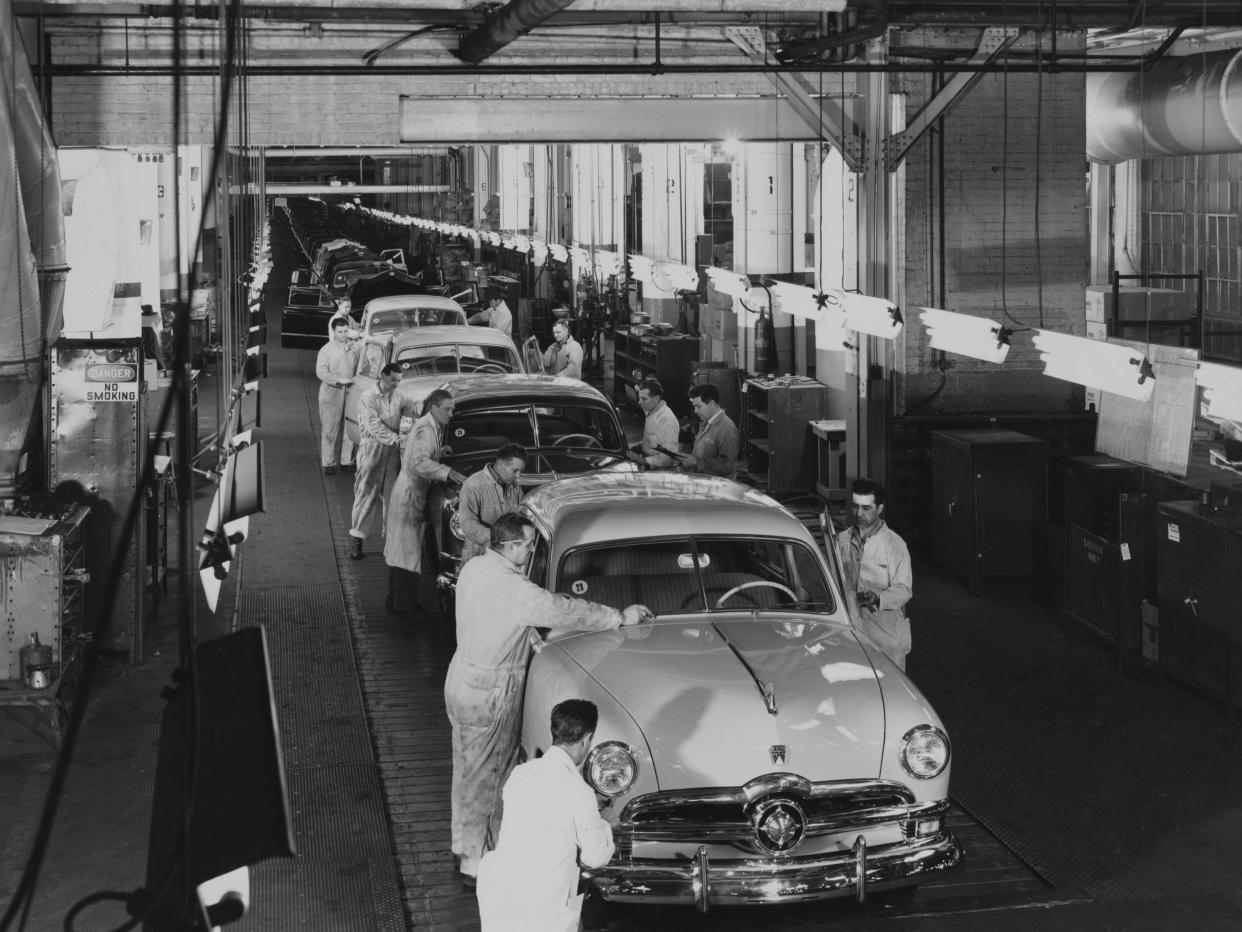 Ford workers put the finishing touches to the Custom Deluxe as they roll off the production line of the Ford assembly plant at Dearborn, Michigan, circa 1950. The vehicles have reached the end of the 1,000-foot assembly line, capable of producing 500 new cars in an eight-hour shift.