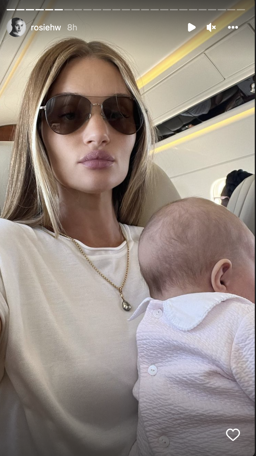 Rosie Huntington-Whiteley shared a photo of her holding daughter Isabella while on a flight.(Photo: Rosie Huntington-Whiteley/Instagram)