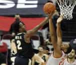 Purdue guard Eric Hunter, left, goes up for a shot against Ohio State forward Zed Key during the second half of an NCAA college basketball game in Columbus, Ohio, Tuesday, Jan. 19, 2021. (AP Photo/Paul Vernon)