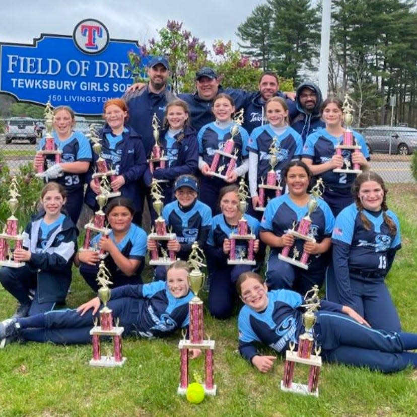 Members of the 2024 Taunton Tornadoes 10U team hold their trophies after winning the Tewksbury Girls Softball League's 15th Annual Think Pink Invitational on May 5, 2024.
