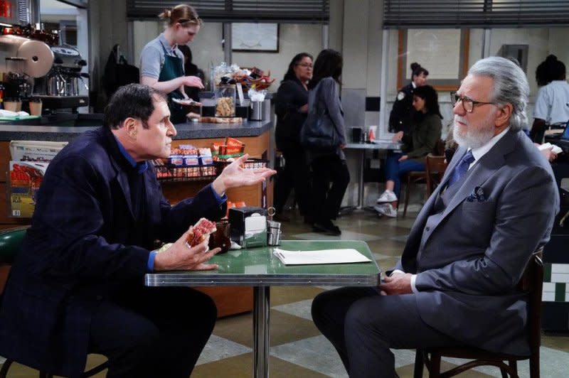 Dan (John Larroqette, R) confronts a producer (Richard Kind). Photo courtesy of NBC