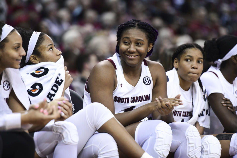 South Carolina forward Aliyah Boston (4) smiles from the bench during the second half of an NCAA college basketball game Monday, Feb. 17, 2020, in Columbia, S.C. South Carolina defeated Vanderbilt 95-44. (AP Photo/Sean Rayford)