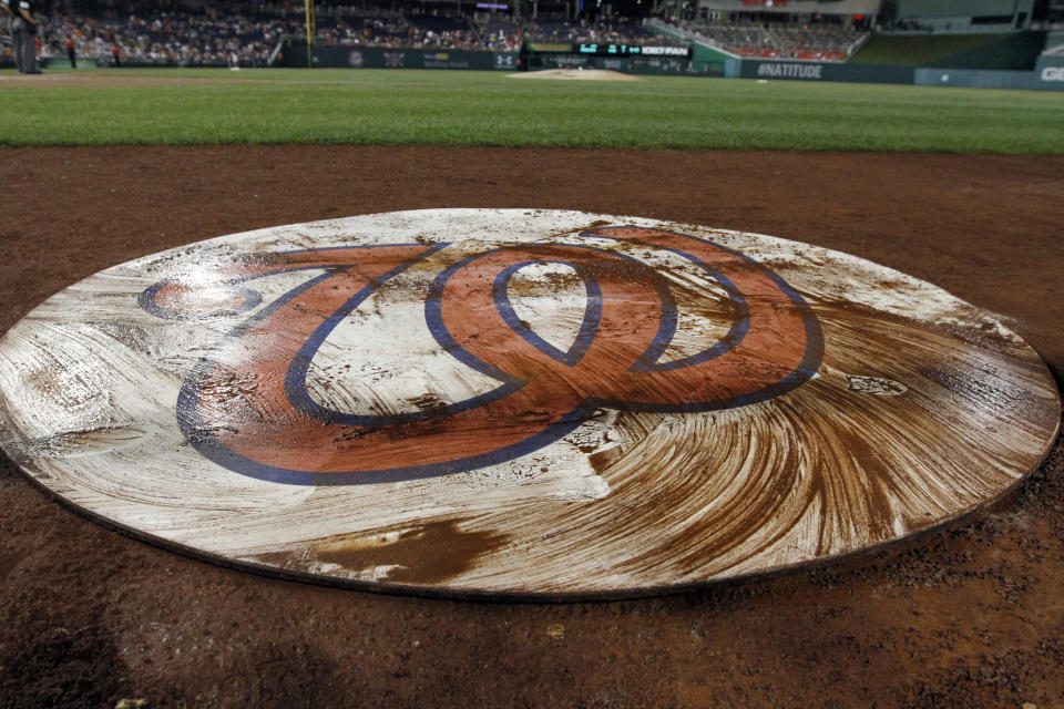 The Washington Nationals on-deck circle has a coating of mud after a rain delay during a baseball game against the San Francisco Giants at Nationals Park Tuesday, Aug. 13, 2013, in Washington. The Nationals won 4-2. (AP Photo/Alex Brandon)