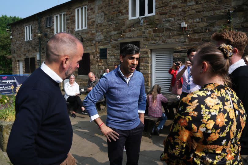 Rishi Sunak speaks to voters during a visit to Bury in May