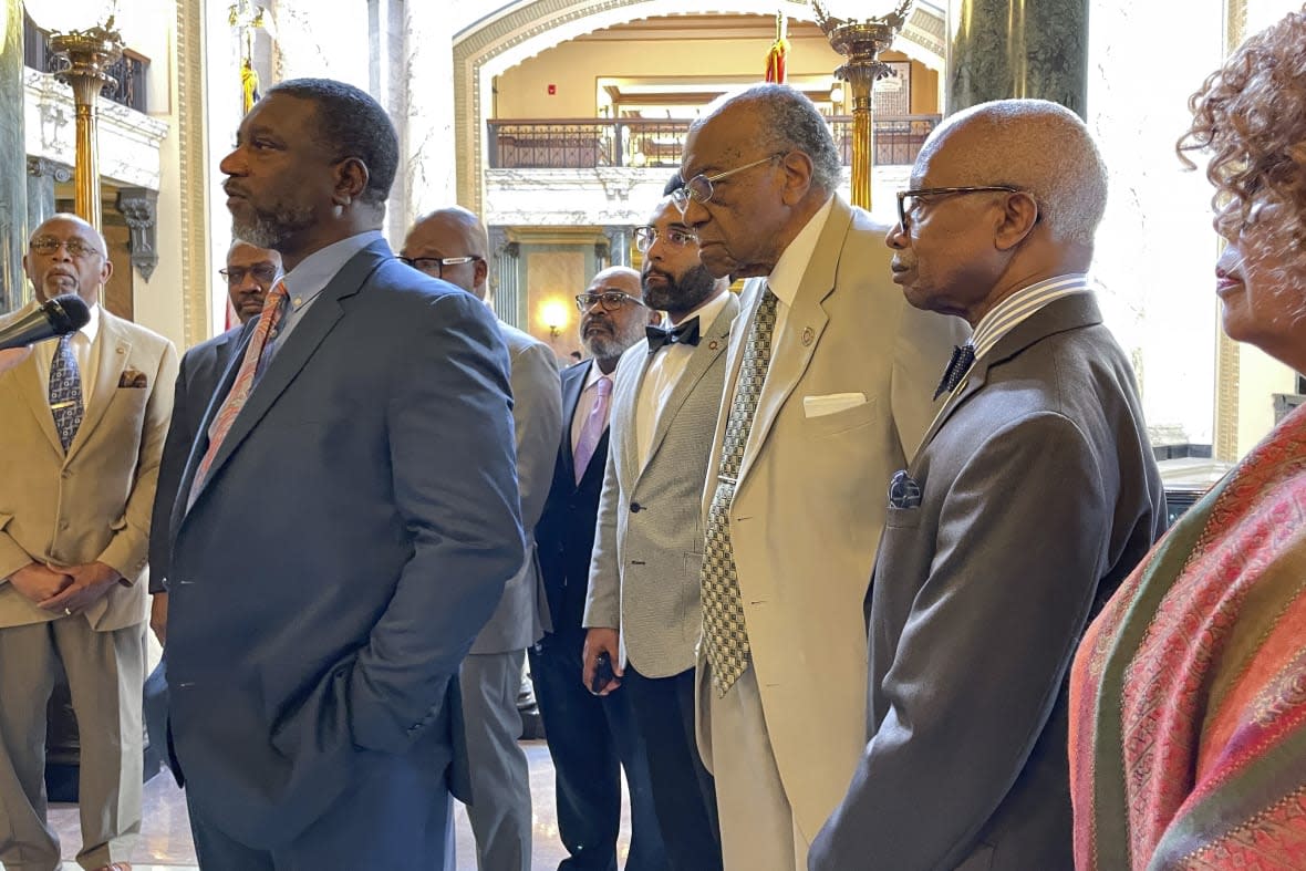 Mississippi state Sen. Juan Barnett, D-Heidelberg, left, speaks at a news conference Wednesday, March 29, 2023, at the state Capitol in Jackson, Miss., while surrounded by other members of the Legislative Black Caucus. (AP Photo/Emily Wagster Pettus)