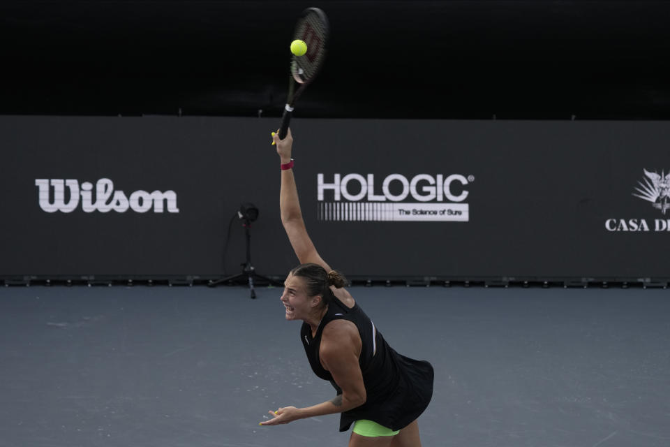 Aryna Sabalenka, of Belarus, serves against Elena Rybakina, of Kazakhstan, during a women's singles match at the WTA Finals tennis championships, in Cancun , Mexico, Friday, Nov. 3, 2023. (AP Photo/Fernando Llano)