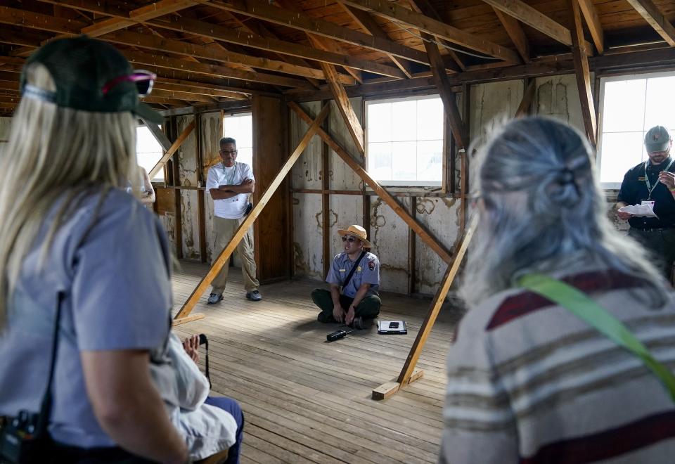 Kurt Ikeda, Director of Interpretation and Education at Minidoka National Historic Site, speaks in an original barracks returned to the site during a tour of the Minidoka National Historic Site, Saturday, July 8, 2023, in Jerome, Idaho. (AP Photo/Lindsey Wasson)