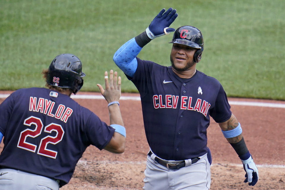 Cleveland Indians' Harold Ramirez, right, celebrates with Josh Naylor after hitting a solo home run during the fifth inning of a baseball game in Pittsburgh, Sunday, June 20, 2021. (AP Photo/Gene J. Puskar)