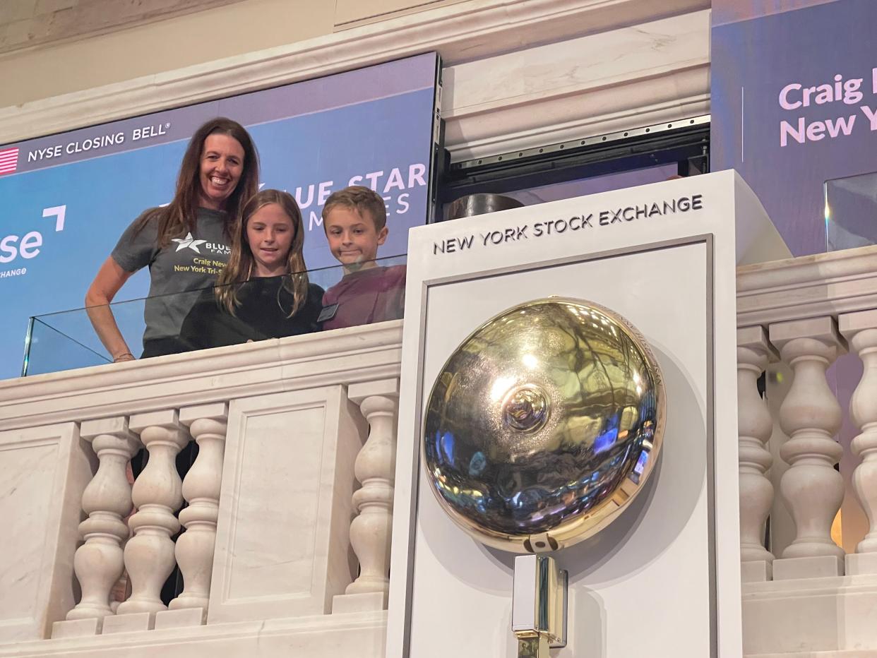 Andie Coakley (from left) is shown with two of her four children, Abbey and Jake in November 2022 at the New York Stock Exchange. Coakley, former New York Tri-State chapter director for Blue Star Families, was one of several members of the local organization welcomed to help ring the closing bell at the stock exchange in recognition of military families.