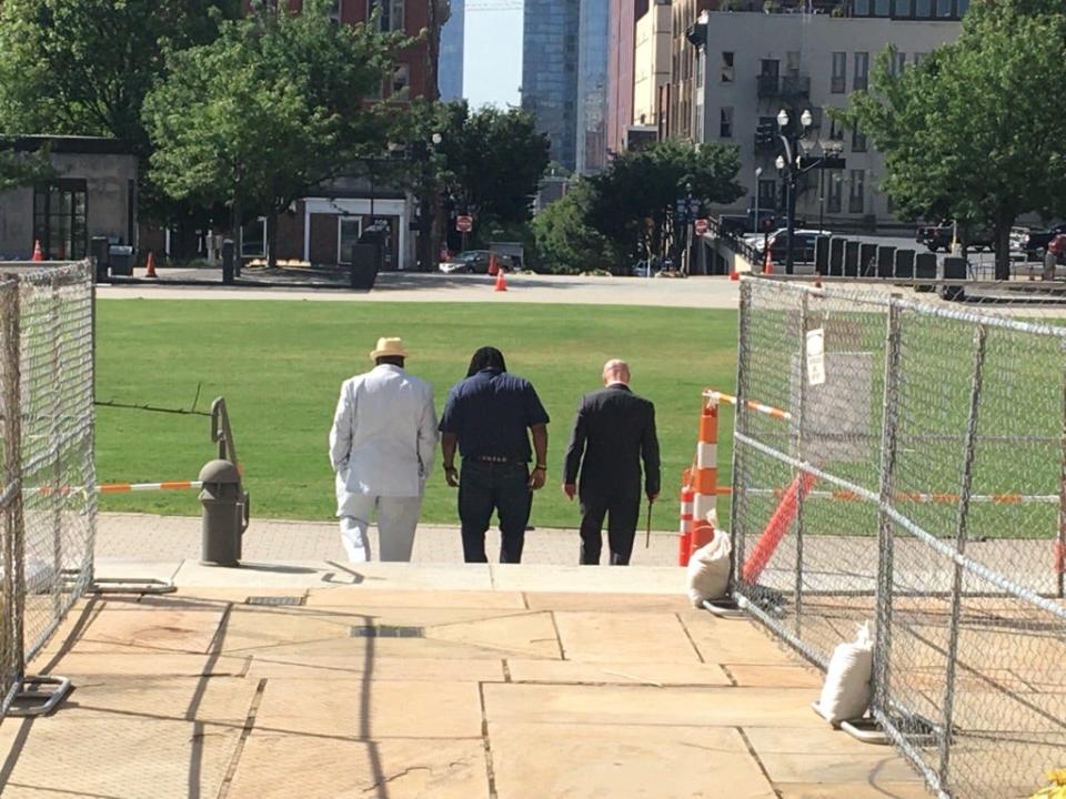 William Arnold, 48, center, leaves the Davidson County Courthouse on Monday morning, free of a child rape conviction from 2013 after the District Attorney General's office declined to retry the case. An appeals court in February found serious prosecutorial misconduct in the original trial and vacated his conviction. He walks with his attorney, Patrick McNally, right and an unknown person. Arnold has maintained his innocence, and says he was misidentified for another William.