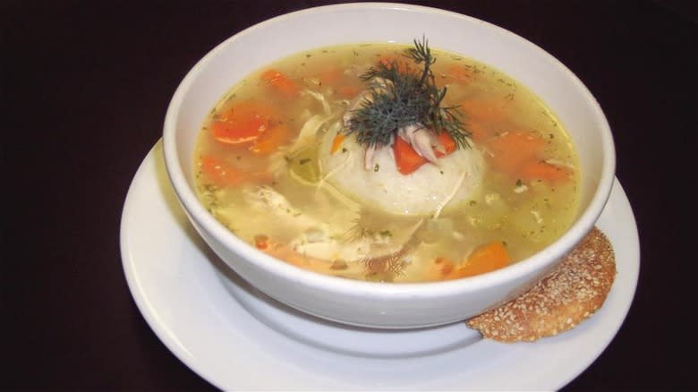 Chicken soup in white bowl