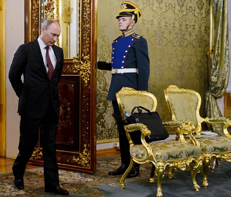 Russian President Vladimir Putin enters a hall for negotiations with Japanese Prime Minister in Moscow on April 29, 2013. When Putin returned one year ago to the Kremlin, Russia could boast robust if unspectacular growth, but in just 12 months, growth has slipped to the extent that Russia risks entering recession