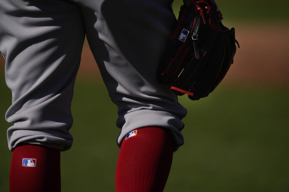 Boston Red Sox pitcher Darwinzon Hernandez (63) holds a glove and waits to workout during spring training baseball practice on Monday, Feb. 22, 2021, in Fort Myers, Fla. (AP Photo/Brynn Anderson)