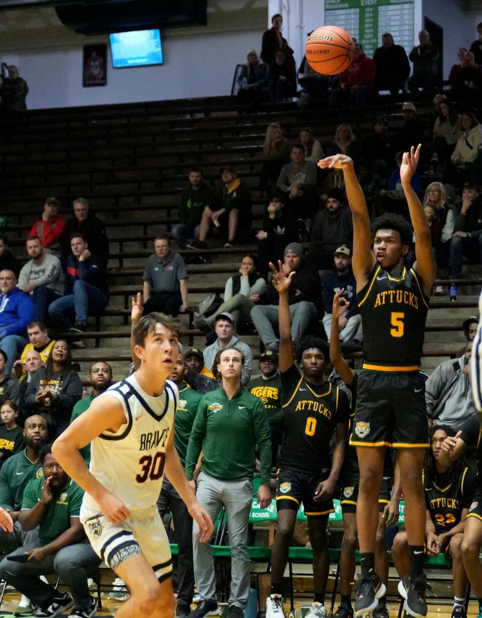 Crispus Attucks guard Ron Rutland III (5) shoots the ball during the 2023 Indiana Hall of Fame Classic. Crispus Attucks defeats Brownstown 76-51.