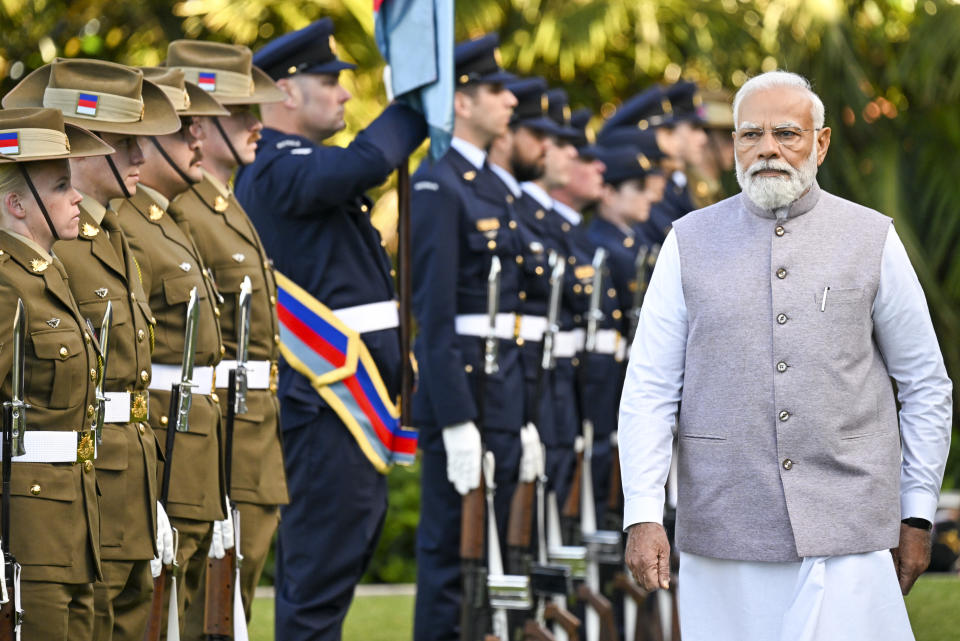 India's Prime Minister Narendra Modi inspects a military parade during a ceremonial welcome at Admiralty House in Sydney, Australia, Wednesday, May 24, 2023. Modi is the only leader of the so-called Quad nations to continue with his scheduled visit to Australia after U.S. President Joe Biden pulled out of a planned meeting of the group in Sydney to return to Washington to focus on debt limit talks. (Saeed Khan/Pool Photo via AP)