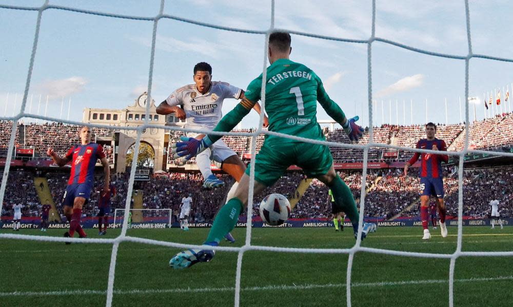 Jude Bellingham nudges the ball through Marc-André ter Stegen’s legs for Real Madrid’s 92nd-minute winning goal