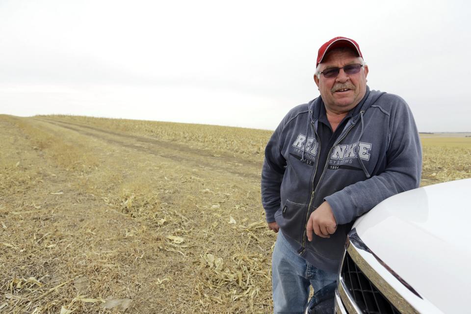 In this March 17, 2014 photo Tom Rutjens, a construction-company owner, poses for a photo in a field he owns in Tilden, Neb., along the route of the TransCanada XL pipeline. Rutjens, who signed agreements to let TransCanada run the line through his property, said he knew of two landowners who were dead-set against the pipeline, but more who were willing to accept the risks of having the pipeline in exchange for the payments. (AP Photo/Nati Harnik)