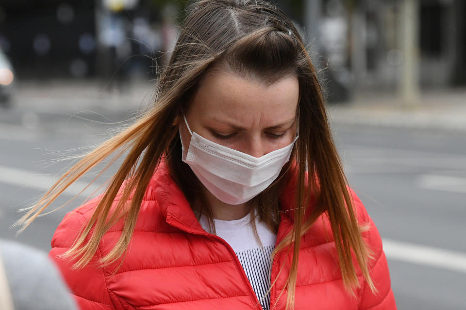 Aurora Iacomi, 31, arrives at Inner London Crown Court for sentencing after she admitted putting cleaning fluid into her supervisor's coffee flask at Fenchurch Street railway station on April 22.