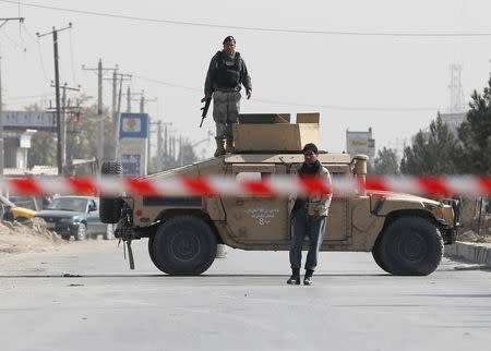 Afghan policemen keep watch at the site of a suicide attack in Kabul, Afghanistan October 29, 2018. REUTERS/Omar Sobhani