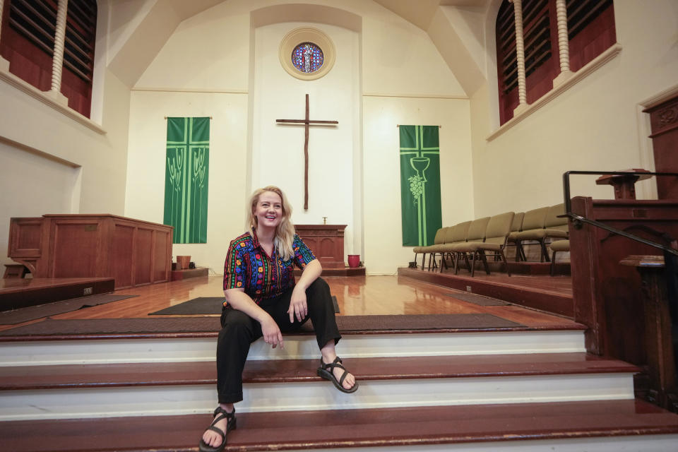 Pastor Ruth Schmidt poses for a picture at the Altadena Community Church in Altadena, Calif., on Tuesday, May 21, 2024. Schmidt, who now serves as a pastor at Claremont Presbyterian Church and is on track to be ordained in the United Church of Christ, said she would like to see faculty and staff at Fuller get the same protections as students. Fuller Theological Seminary, an evangelical school is deliberating whether to become more open to LGBTQ+ students who previously faced possible expulsion if found to be in a same-sex union. (AP Photo/Damian Dovarganes)