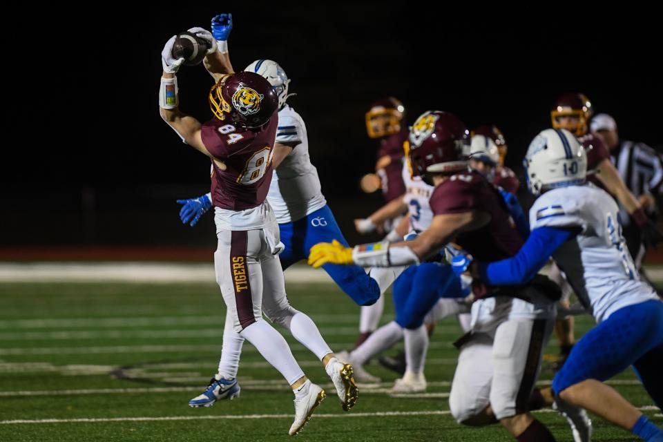 Harrisburg's wide receiver Tytan Tryon (84) catches the ball during a play on Friday, Nov. 3, 2023 at Harrisburg High School in Harrisburg, South Dakota.