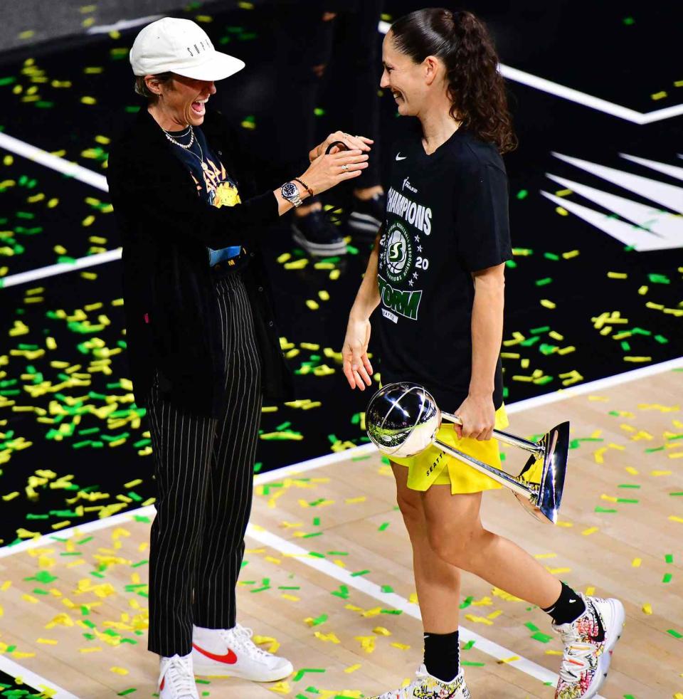 Megan Rapinoe reacts to Sue Bird #10 of the Seattle Storm after the Storm defeated the Las Vegas Aces in Game 3 of the WNBA Finals to win the championship at Feld Entertainment Center on October 06, 2020 in Palmetto, Florida