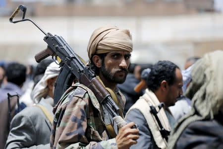 A tribesman loyal to the Houthi movement carries his rifle as he attends a gathering in Yemen's capital Sanaa, April 17, 2016. REUTERS/Khaled Abdullah