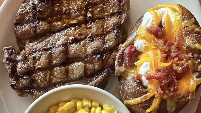 Steak with loaded baked potato