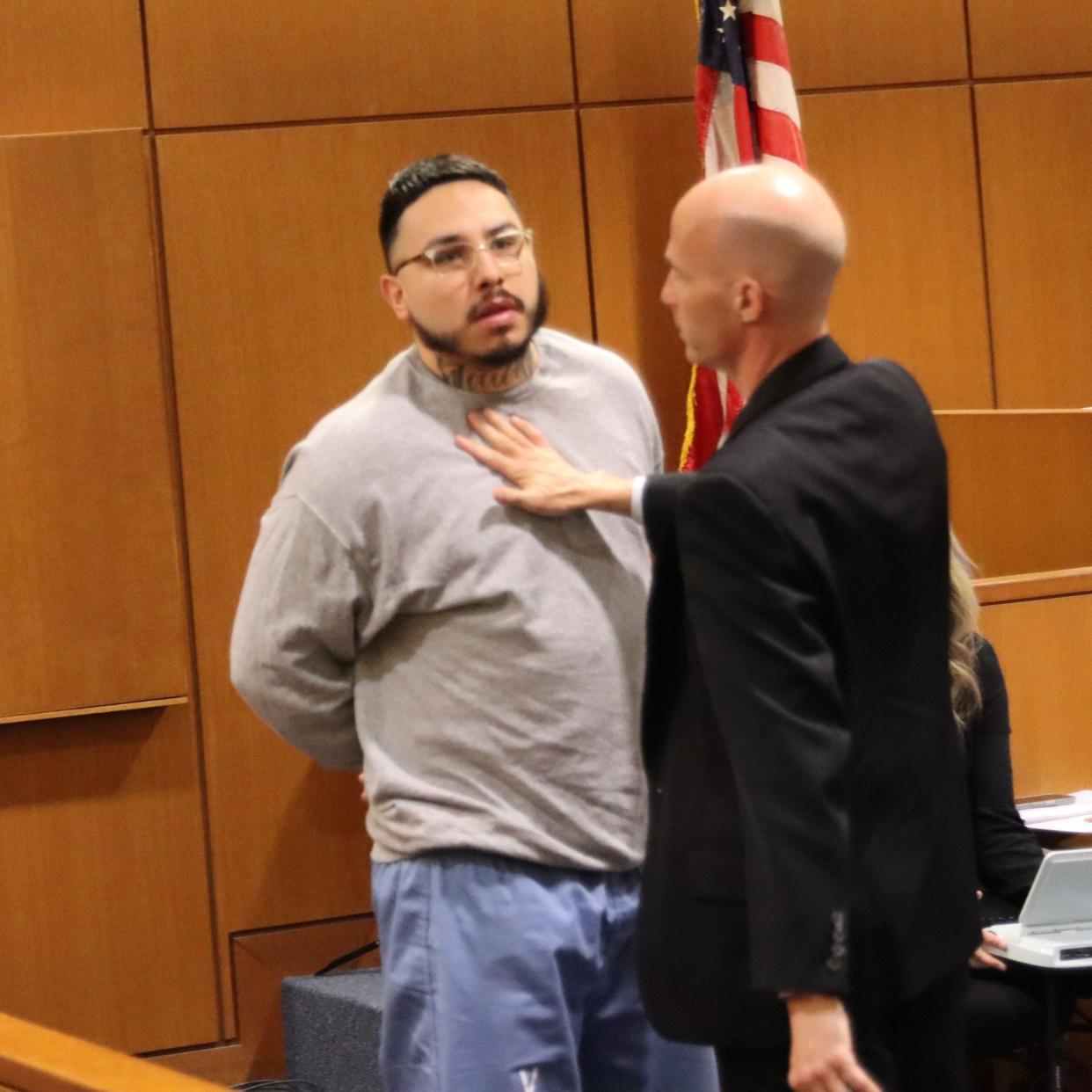 Euren Balbuena reacts after a relative of the victim lunged at him during sentencing Wednesday for the 2020 murder of his girlfriend.