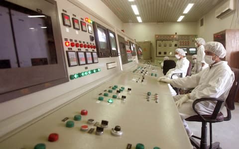 Technicians of Iran's Atomic Energy Organisation in a control room supervise resumption of activities at the Uranium Conversion Facility in Isfahan, Iran - Credit: Reuters
