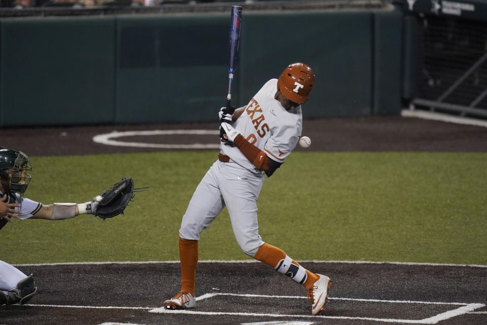 Texas' Trey Faltine is hit with a pitch by South Florida's Orion Kerkering during the fourth inning of an NCAA Super Regional college baseball game, Sunday, June 13, 2021, in Austin, Texas. (AP Photo/Eric Gay)