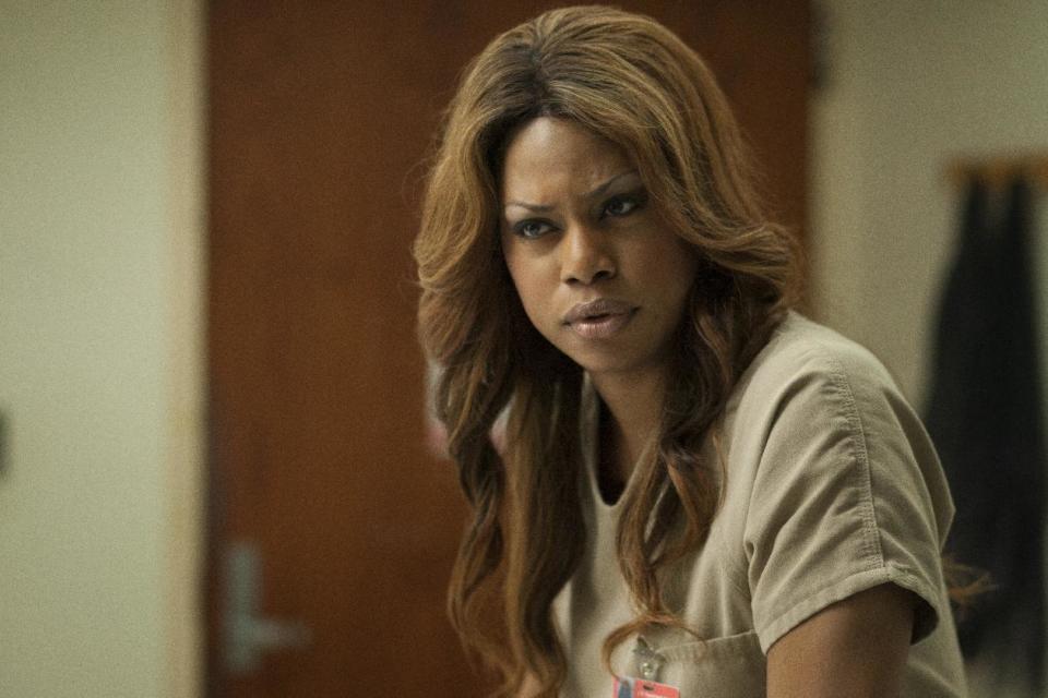 This image released by Netflix shows Laverne Cox in a scene from "Orange is the New Black." The Netflix show set in a women’s prison was named outstanding comedy series at the 25th annual GLAAD Media Awards’ New York ceremony. Cast members, including Cox, who won her own GLAAD honor at the organization’s Los Angeles awards ceremony last month, accepted the award Saturday, May 3, 2014, at the Waldorf Astoria hotel. (AP Photo/Netflix, Eric Leibowitz, file)