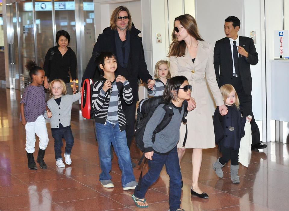 Brad Pitt and Angelina Jolie in airport with children