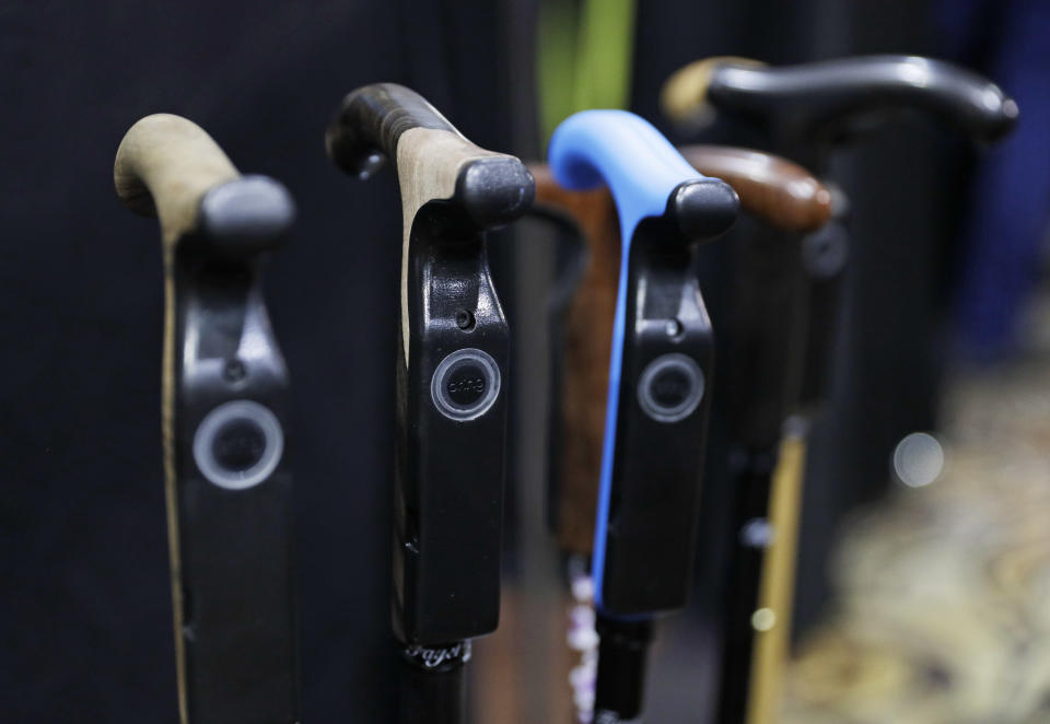 The Smartcane is on display during CES Unveiled before CES International, Tuesday, Jan. 3, 2017, in Las Vegas. The cane can understand a user's habits and detect unusual situations and alert a caregiver. (AP Photo/John Locher)