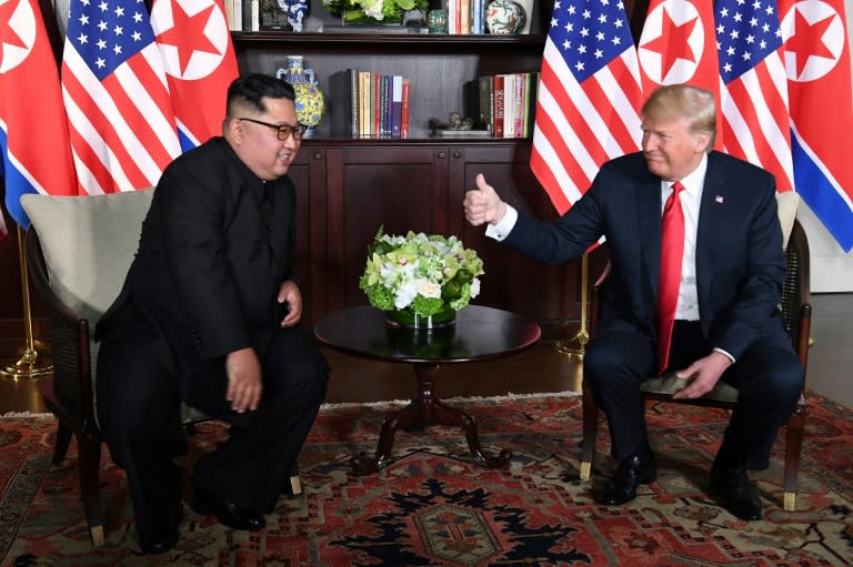 Donald Trump and Kim Jong Un shared upbeat words as they sat down together for the first time