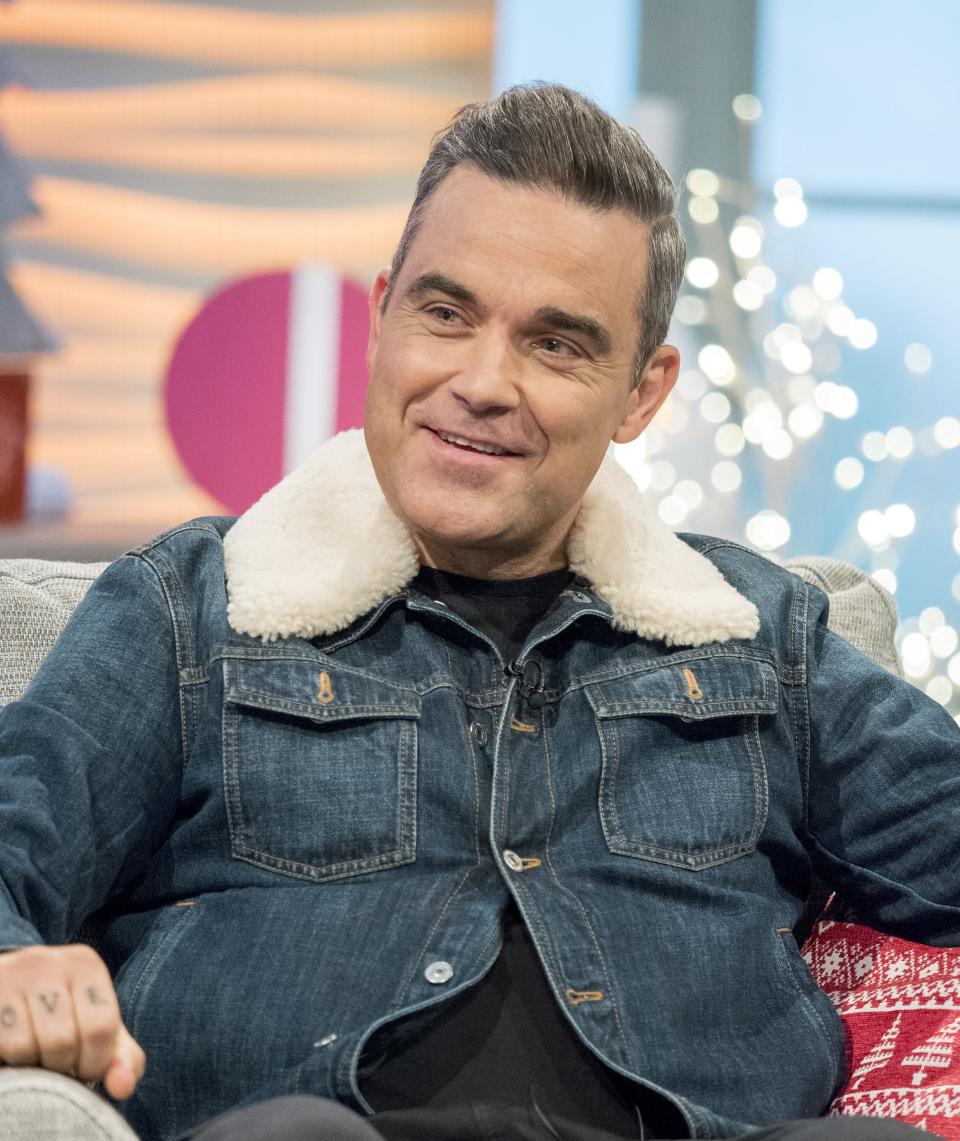 Robbie Williams is fitter and healthier than his formative years. (Credit: REX)