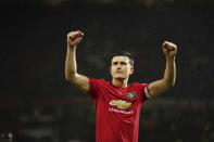 Manchester United's Harry Maguire celebrates after the English Premier League soccer match between Manchester United and Manchester City at Old Trafford in Manchester, England, Sunday, March 8, 2020. Manchester United won 2-0. (AP Photo/Dave Thompson)