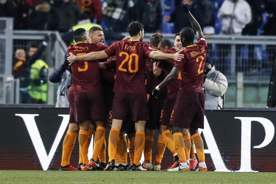 Roma's Edin Dzeko, second from left, celebrates with his teammates after scoring during an Italian Cup, round of 16, soccer match between Roma and Sampdoria, at Rome's Olympic stadium, Thursday, Jan. 19, 2017. (Angelo Carconi/ANSA via AP)