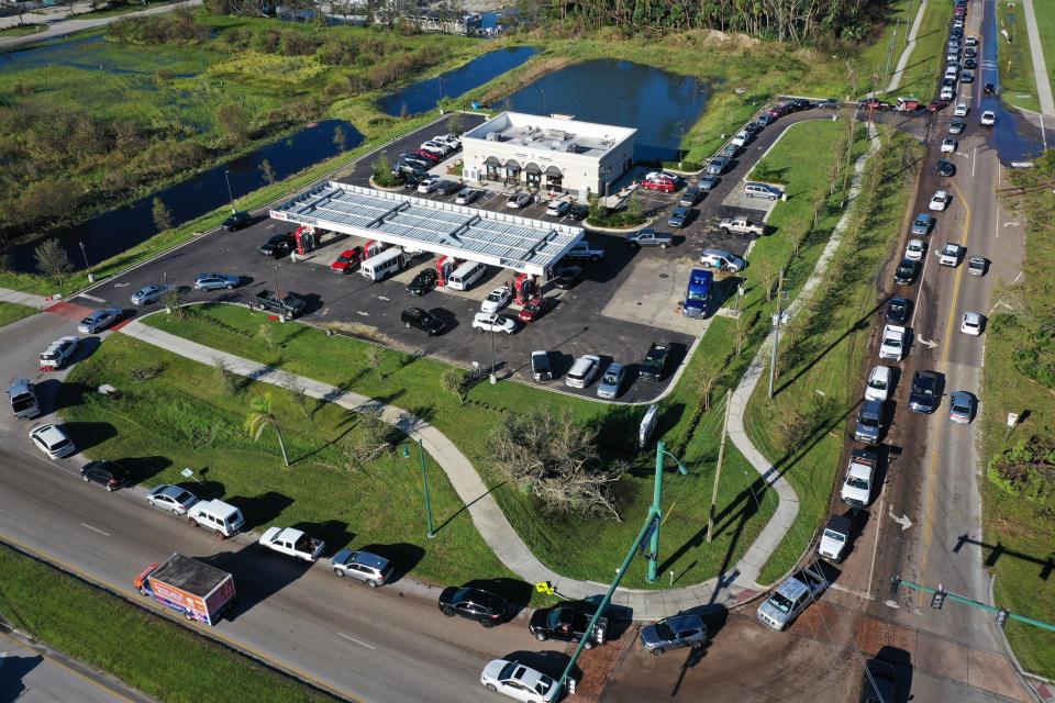 A line of cars waiting to enter a gas station for fuel in Port Charlotte, Florida.