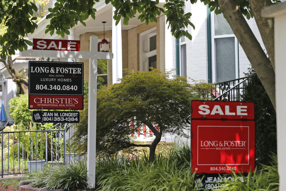 In this Friday, Aug. 16, 2019, photo for sale signs beckon buyers to homes along Park Avenue in Richmond, Va. On Wednesday, Aug. 21, the National Association of Realtors reports on sales of existing homes in July. (AP Photo/Steve Helber)