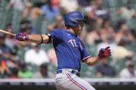 Texas Rangers' Nathaniel Lowe hits a RBI single to center during the seventh inning of a baseball game against the Detroit Tigers, Wednesday, May 31, 2023, in Detroit. (AP Photo/Carlos Osorio)