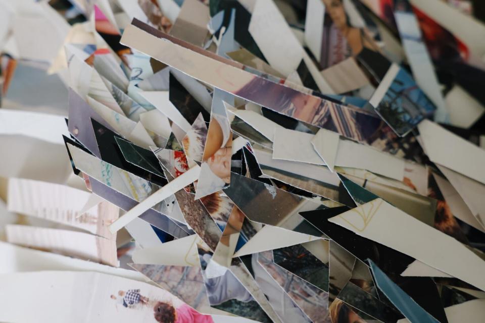 A pile of photographs cut into pieces