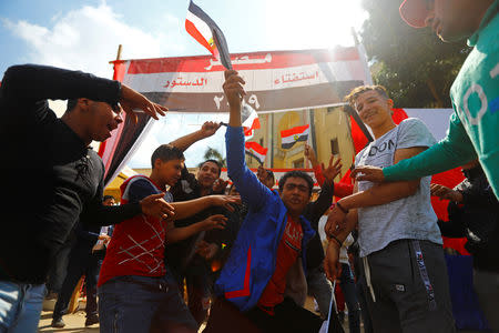 People celebrate during the second day of the referendum on draft constitutional amendments, outside a polling station in Cairo, Egypt April 21, 2019. REUTERS/Amr Abdallah Dalsh