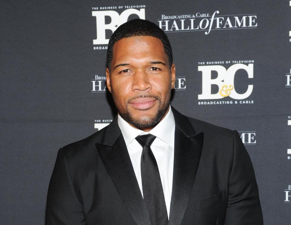 FILE - This Oct. 28, 2013 file photo shows former professional football player Michael Strahan, co-host of "Live with Kelly and Michael," attending the 23rd Annual Broadcasting & Cable Hall of Fame Awards in New York. Strahan has made good on reports that he is joining "Good Morning America" by paying a visit to the ABC breakfast show on Tuesday, April 15, 2014. The former football star and current co-host with Kelly Ripa of "Live With Kelly and Michael" will join "Good Morning America" part-time. (Photo by Evan Agostini/Invision/AP, File)